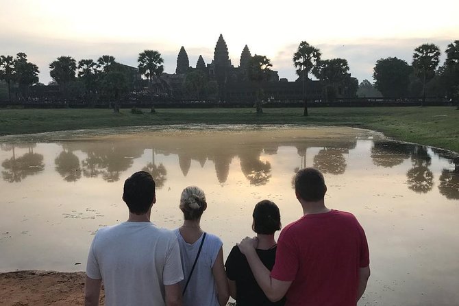 2-D Angkor temple tour with one sunrise in A/C vehicle and guide. - Day one: Ta Prohm, Pre Rup, and the red sandstone temples