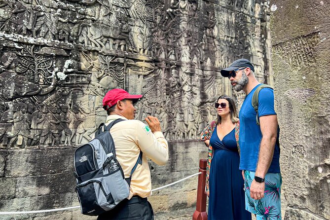 2-Day Angkor Wat Tour with Banteay Srei and Floating Village - Day 1: entering Angkor Thom through its grand monuments
