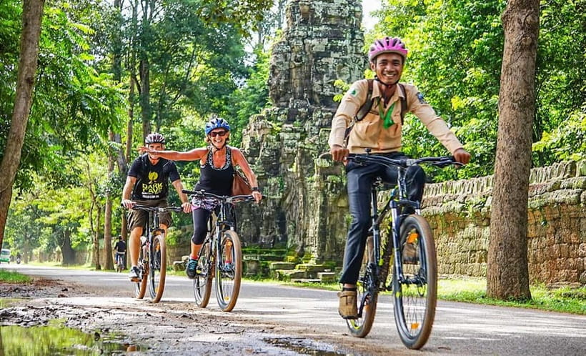Angkor Bike tour & Gondola Sunset Boat - Rice fields and family plots beyond the park roads