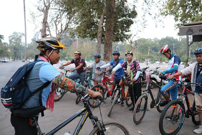 Angkor Sunrise Expedition Cycling Through Serene Backroads - Bayon and the famous stone faces