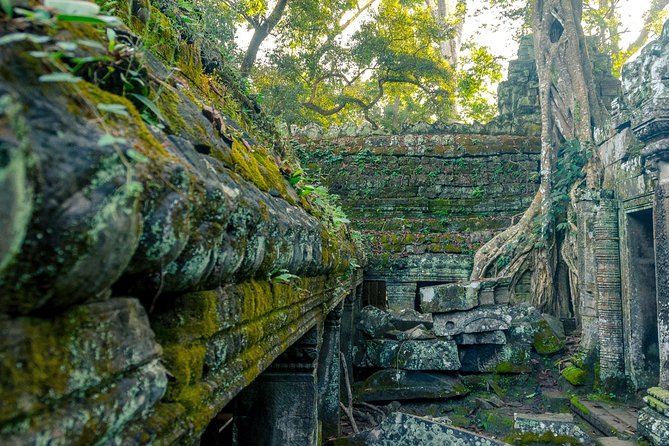 Angkor Wat Sunrise or Sunset Tour with Guide from Siem Reap - Bayon and Angkor Thom: faces, gates, and scale