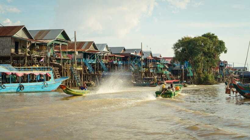 From Siem Reap: Kampong Phluk Floating Village Tour by Boat - Walking through the stilted village