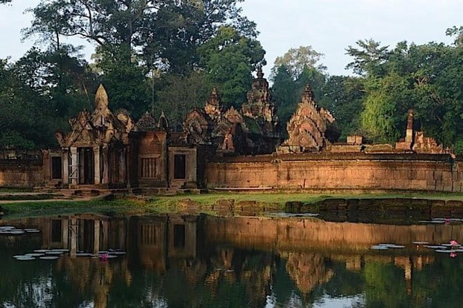 Full-Day Guided Bicycle Tour in Angkor Wat Temple - Entering Angkor Thom through the stone gate