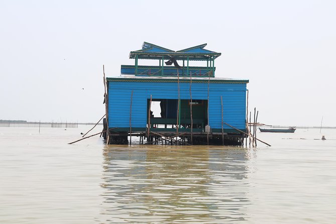 Guided Floating Village Boat Tour in Siem Reap - Boarding the long-tail boat