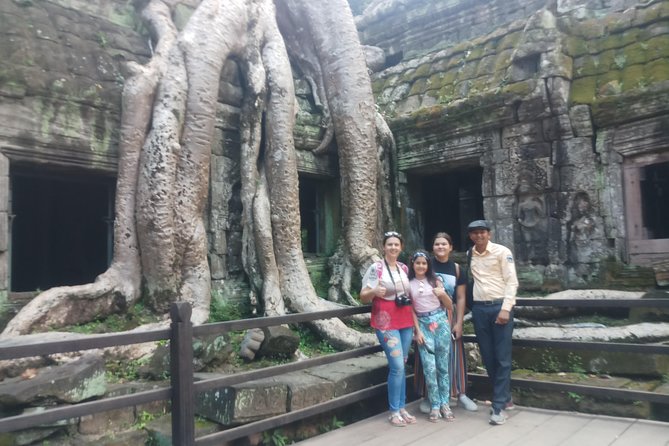 One day Angkor temple tour with private driver - Ta Prohm, where stone and trees share the frame
