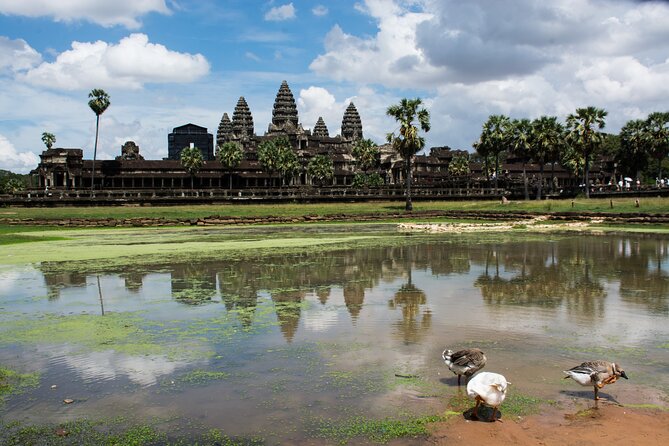 Private Sunrise Angkor Wat Tour with pickup from your hotel - Bayon’s famous stone faces