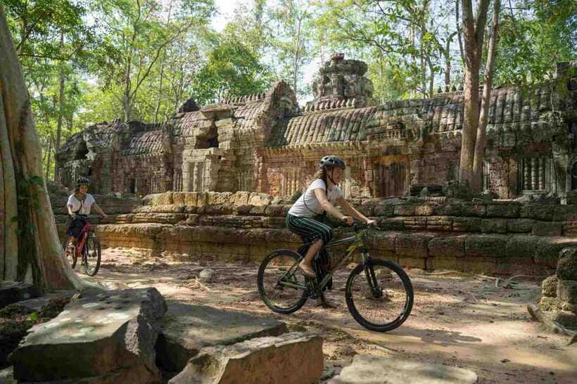 Siem Reap: Angkor Temples Off-Track Bicycle Tour - Bayon’s stone faces and the quieter temple nearby
