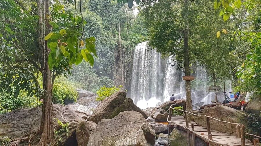 Siem Reap: Magical Kulen Mountain by Cambodiajeep - Swimming beneath the Phnom Kulen waterfall