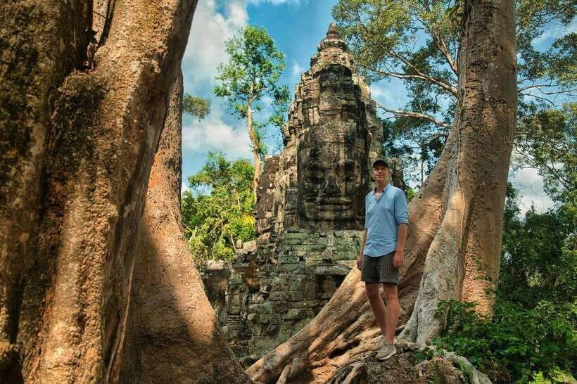 Small-Group Full Day Angkor wat Guide tour with Sun set - Angkor Thom and Bayon: stone faces behind the southern gate