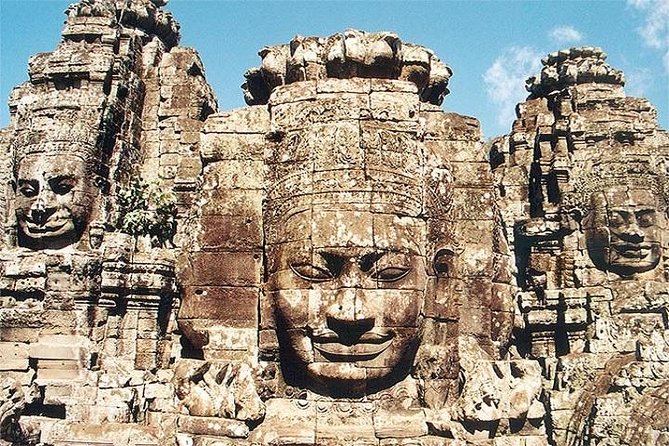 The Angkor Temples from Sunrise by Tuk Tuk - Ta Prohm, where stone meets the forest